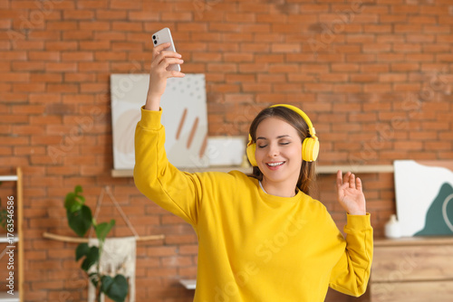 Young woman in headphones w...