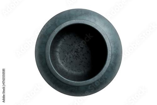 Dark, circular object with a hollow center, suggesting a connector or industrial component.
