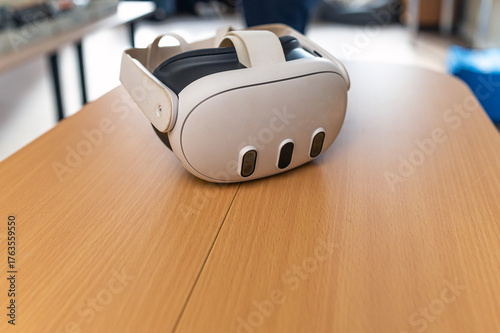 Explore new worlds with a virtual reality headset on a wooden table in a cozy room