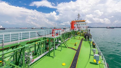 Green deck of the tanker under blue sky timelapse