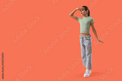 Teenage girl looking at som...