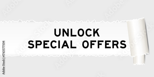 Ripped gray paper background that have word unlock special offer under torn part