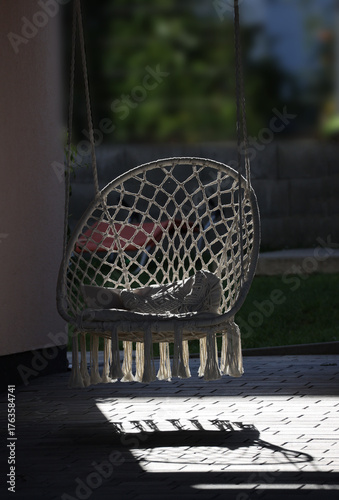 summer scene relaxed macrame swing with sunbeams