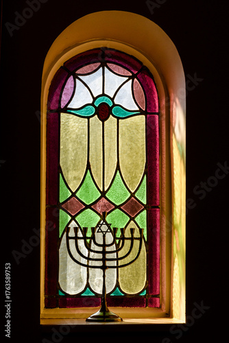 Canvas Print A golden Hanukkah menorah stands in a window in the interior of the Kiever Modern Orthodox synagogue in Toronto, Ontario, Canada