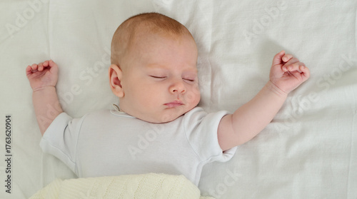 Beautiful baby  asleep on a blanket.
Sleeping baby.