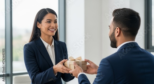 Smiling Businesswoman Giving Wrapped Gift Box in Modern Office