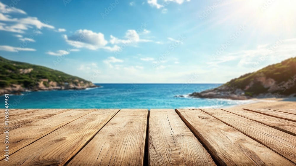 Fototapeta premium A serene wooden deck overlooks a tranquil sea, with blue skies and distant hills, creating a peaceful coastal scene.
