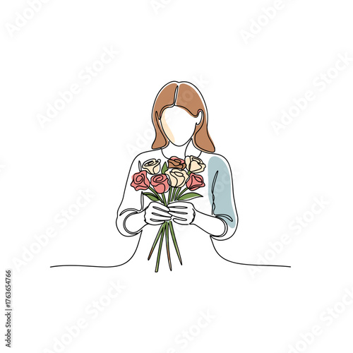 Woman arranging fresh cut flowers in a minimalist style 
