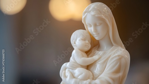 Closeup of a mother and child sculpture made of white alabaster stone