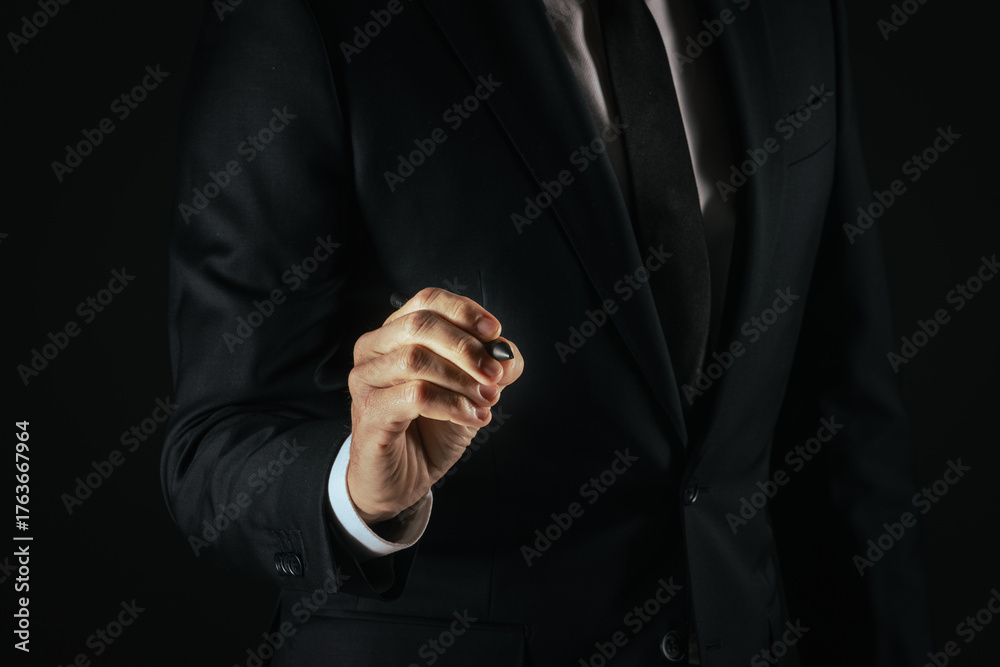 Fototapeta premium Businessman touch with digital pen a futuristic display, write on a virtual screen. Gesture concept