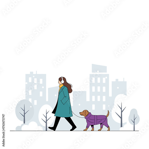 Woman walking a dog in a city park during winter