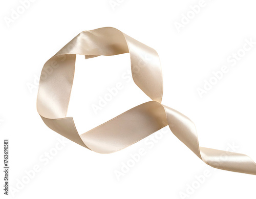 A looping length of shiny, ivory-colored ribbon against a stark black backdrop