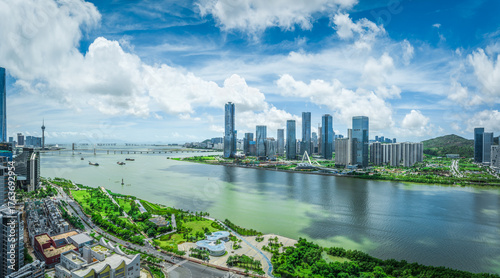 Bilde på lerret Modern financial district skyline of a new city with green parks and a riverfront on a beautiful sunny day in Zhuhai