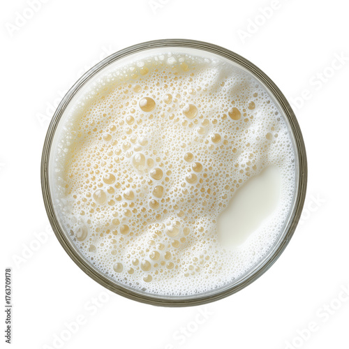 Glass of beer with foam from top view