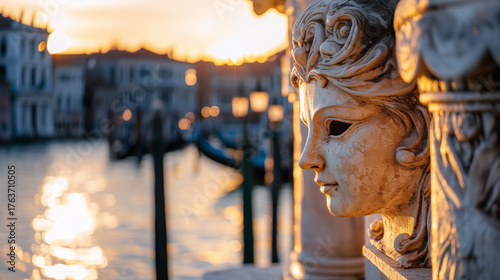 Fototapeta Naklejka Na Ścianę i Meble -  Venetian Mask On Stone Balcony Canal Reflections At Sunset Warm Golden Light Golden Hour Warm