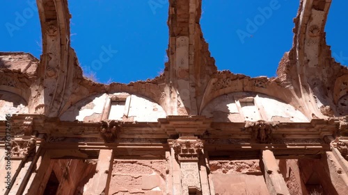 Detailed view of the arched skeletons of the Convent of San Agustin in Belchite, Spain. The eroded stone structures reveal the scars of the Spanish Civil War, capturing texture, history, and silent