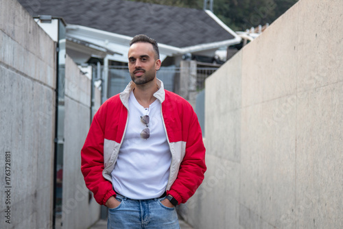 Casual man with hands in pockets walking on the street

arms crossed