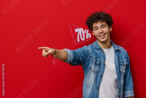 A man pointing to a sign that says 70% on it. black friday, deal,