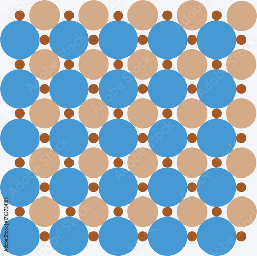 Pattern created from small brown, medium beige and large blue circles on a white background