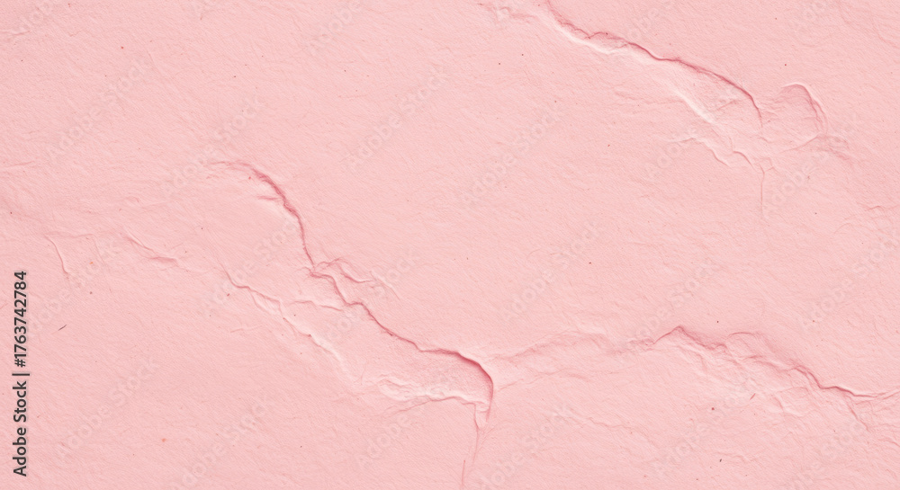 Fototapeta premium Soft pink textured paper background with subtle natural creases for elegant design projects