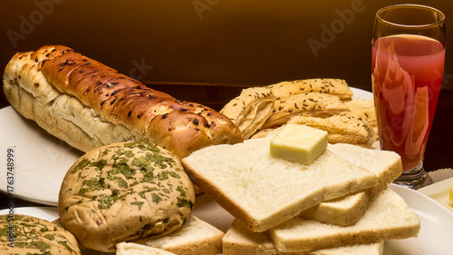 Tableau sur toile A warm and appetizing food composition featuring assorted bakery items including