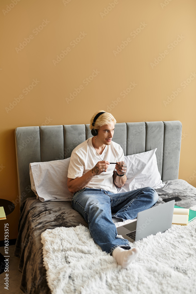 Fototapeta premium Relaxing evening gaming session in a cozy apartment with a stylish young man