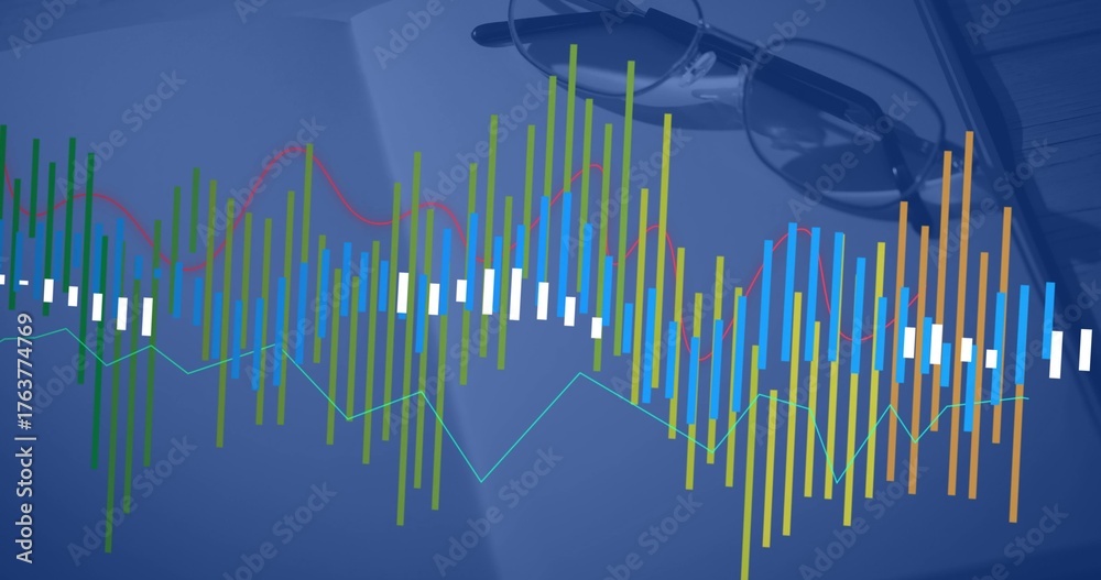 Fototapeta premium Displaying multicolored data visualization overlay on wooden desk, with open book and eyeglasses