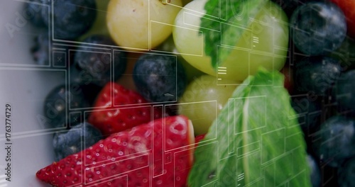 Displaying fruits with UI overlay on dish, with sliced strawberries, blueberries, grapes and mint
