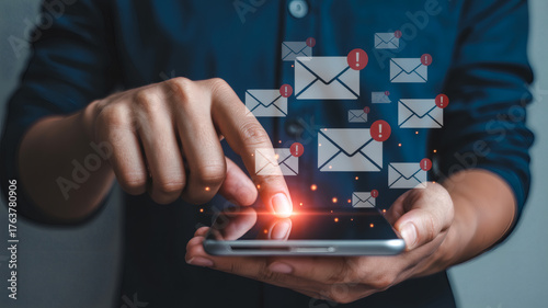 Person interacting with mobile phone overwhelmed by excessive floating email notifications spam digital communication overload technology concept