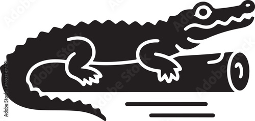 Black silhouette of an alligator resting on a log in water