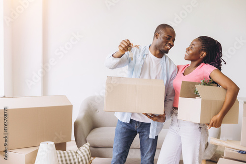 African American couple celebrating moving day new home