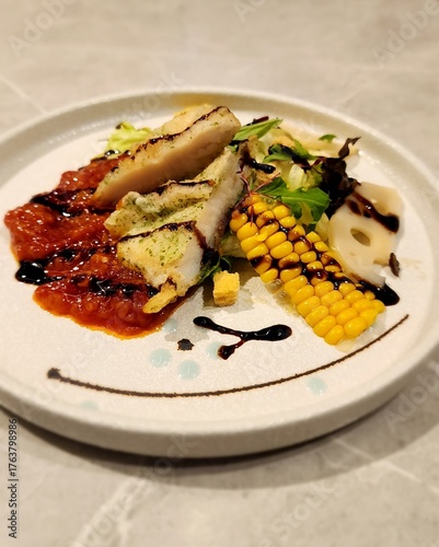 grilled fish with vegetables on white plate for happy dinner