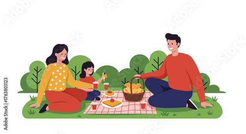 Family picnic in park with parents and child on blanket enjoying outdoor meal