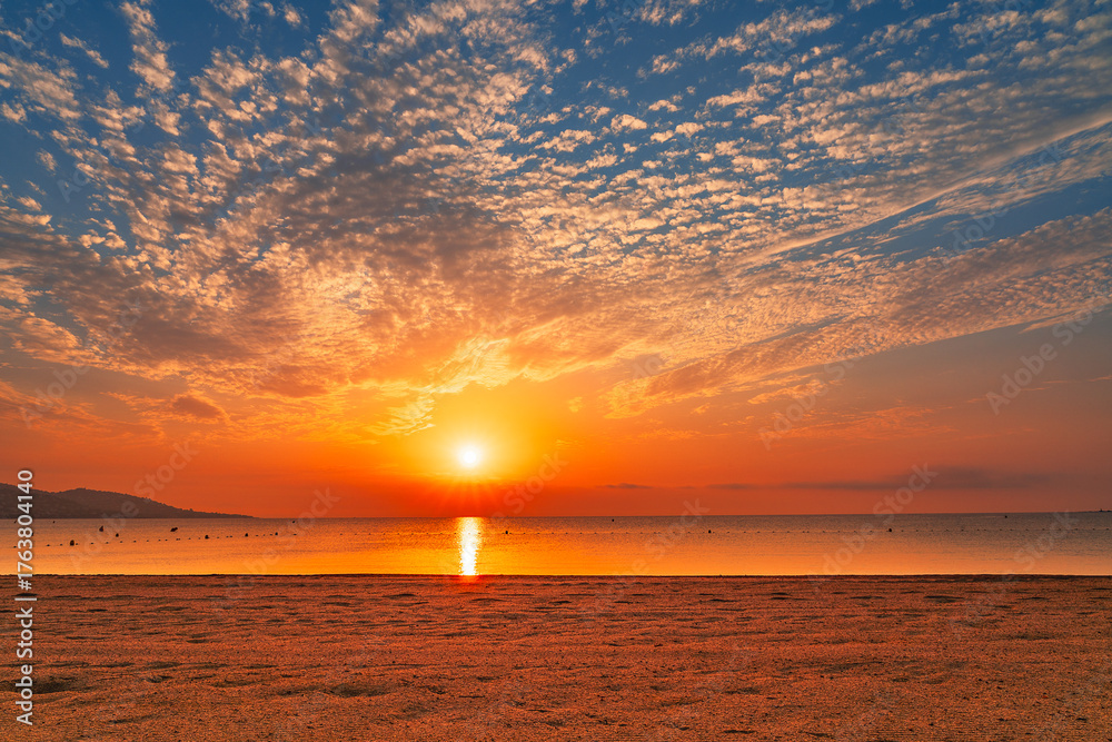 Fototapeta premium Spectacular sky at sunrise over Nartelle beach in Sainte Maxime