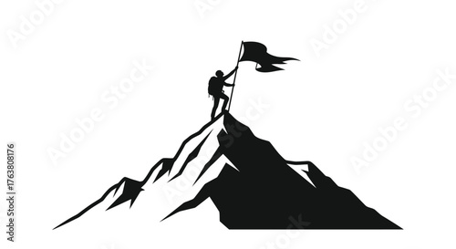 Silhouette of a person raising a flag atop a mountain peak