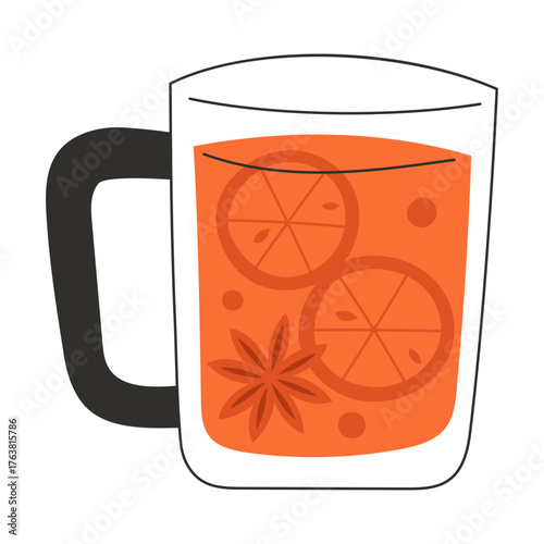 Transparent glass cup with hot autumn herbal tea with spices and citrus fruits