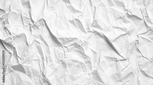 This image shows a close-up view of crumpled white paper, featuring various textures and shadows that add depth to the simple yet creative background.