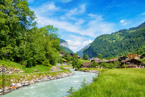 Summer countryside with river and mountains