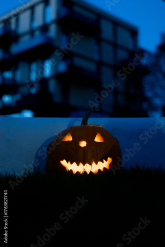 Autumn backyard lighted pumpkins and Halloween Decorations during the night
