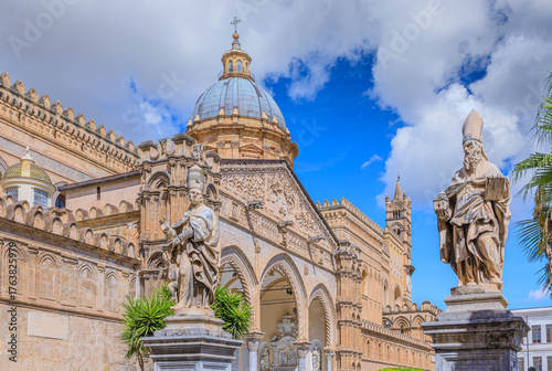 Palermo Cathedral with portico of main facade in Sicily, Italy. Statues of St. Jerome and St. Ambrose, made by  Anello in 1673, placed at the second entrance of the western section of the balustrade.