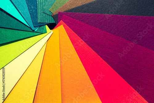 Color palette guide. Colored textured paper samples swatch catalog. Bright and juicy rainbow colors. Beautiful abstract background. Back to school. Office accessories.