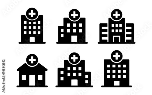 Set of black silhouette hospital building icons with cross symbols for medical design
