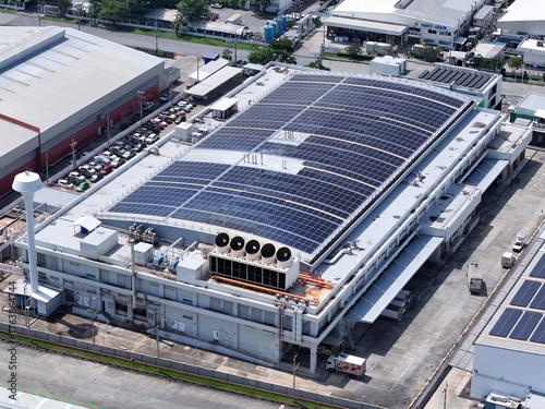 Cooling towers in data center building. Air conditioning cooling towers in front of building with fins to the front. Industrial cooling towers or air cooled water chillers with piping system.