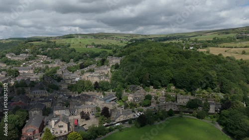 Aerial drone view of the town of Hebden Bridge in West yorkshire moving along the length of the town