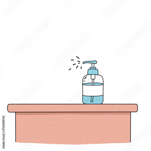Hand sanitizer bottle on countertop with liquid dispensing  
