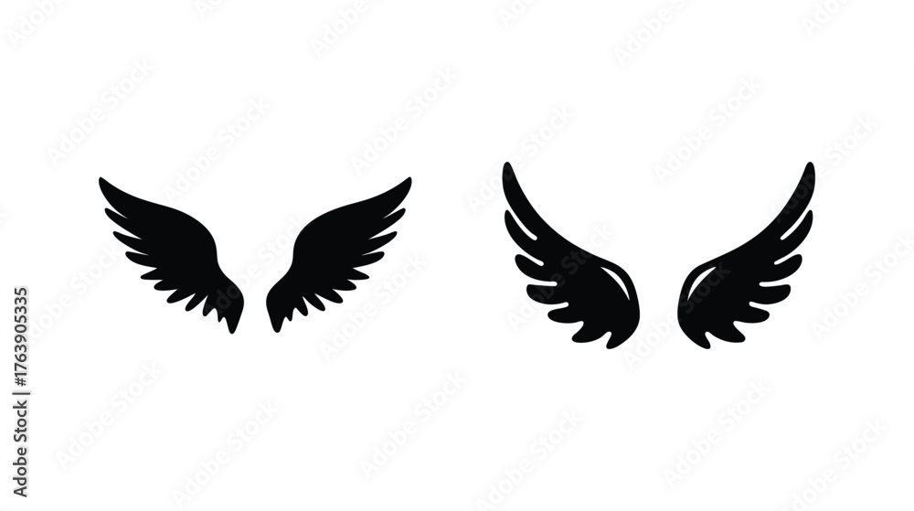 Fototapeta premium Two sets of black feathered wings isolated on a symbolizing freedom and angelic imagery.