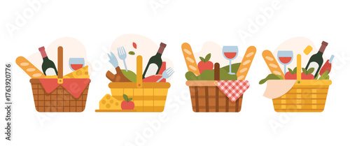 Four festive picnic baskets filled with food wine and glasses