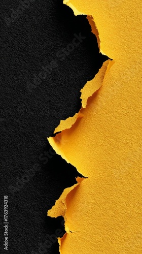 Torn Black and Yellow Paper Creating a Striking Contrast on a Simple Background