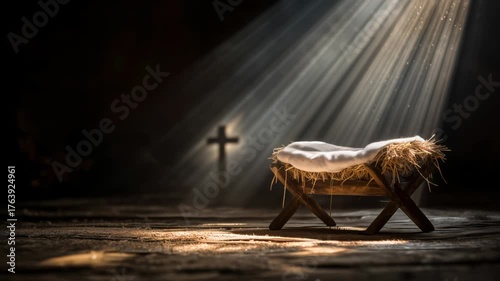Nativity scene with gentle light illuminating a manger and cross in a dark setting