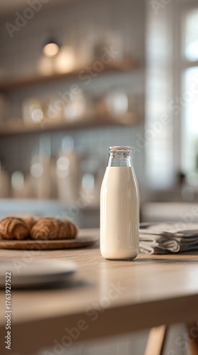Fresh Milk in a Glass Bottle Beside Baked Goods on a Wooden Table in a Cozy K...